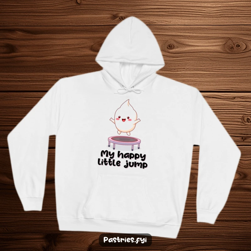 Funny kawaii meringue character excitedly bouncing on a small trampoline, a cozy and humorous hoodie.