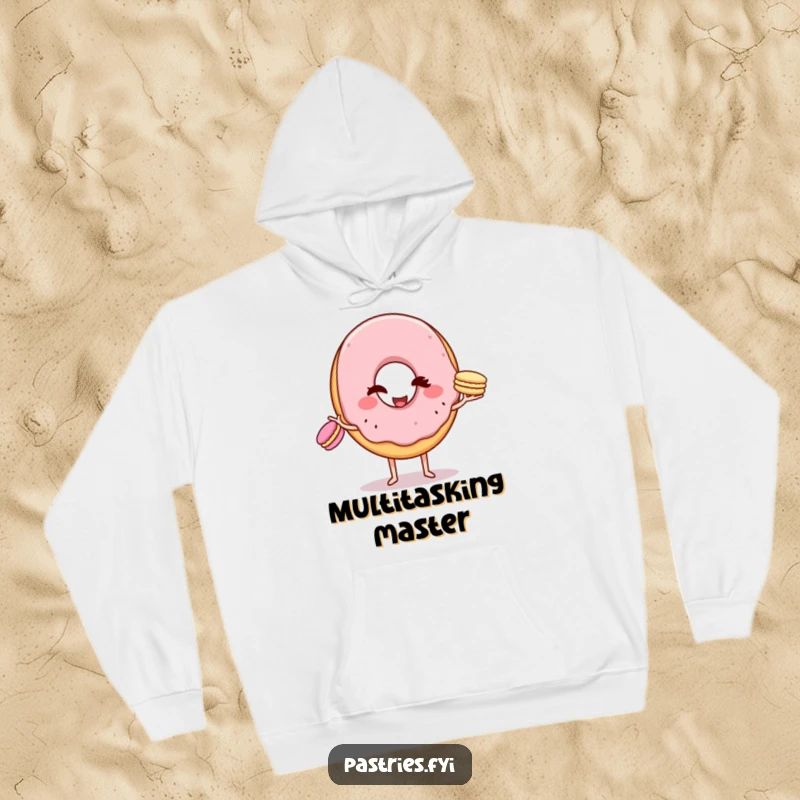 Funny Hoodie: A winking donut character in the process of juggling three tiny macarons, radiating charm and humor.