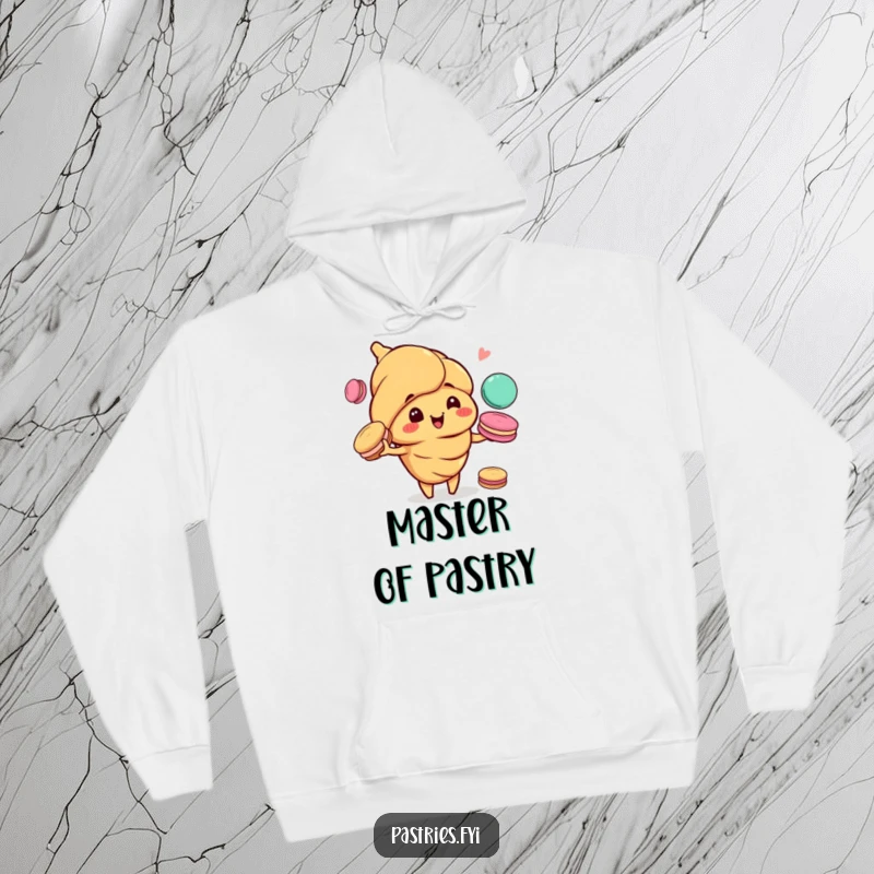Funny hoodie depicting a happy, mischievous croissant character effortlessly juggling colorful macarons, embodying pure pastry joy.